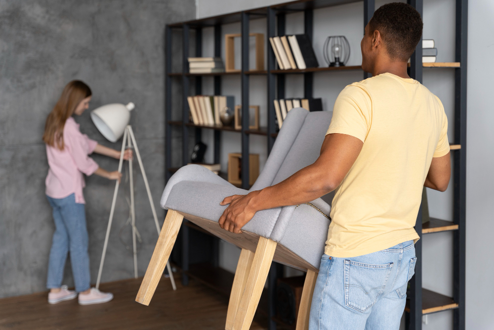 photo-of-close-up-people-making-home-comfortable-yellow-shirt-changing-furniture-around