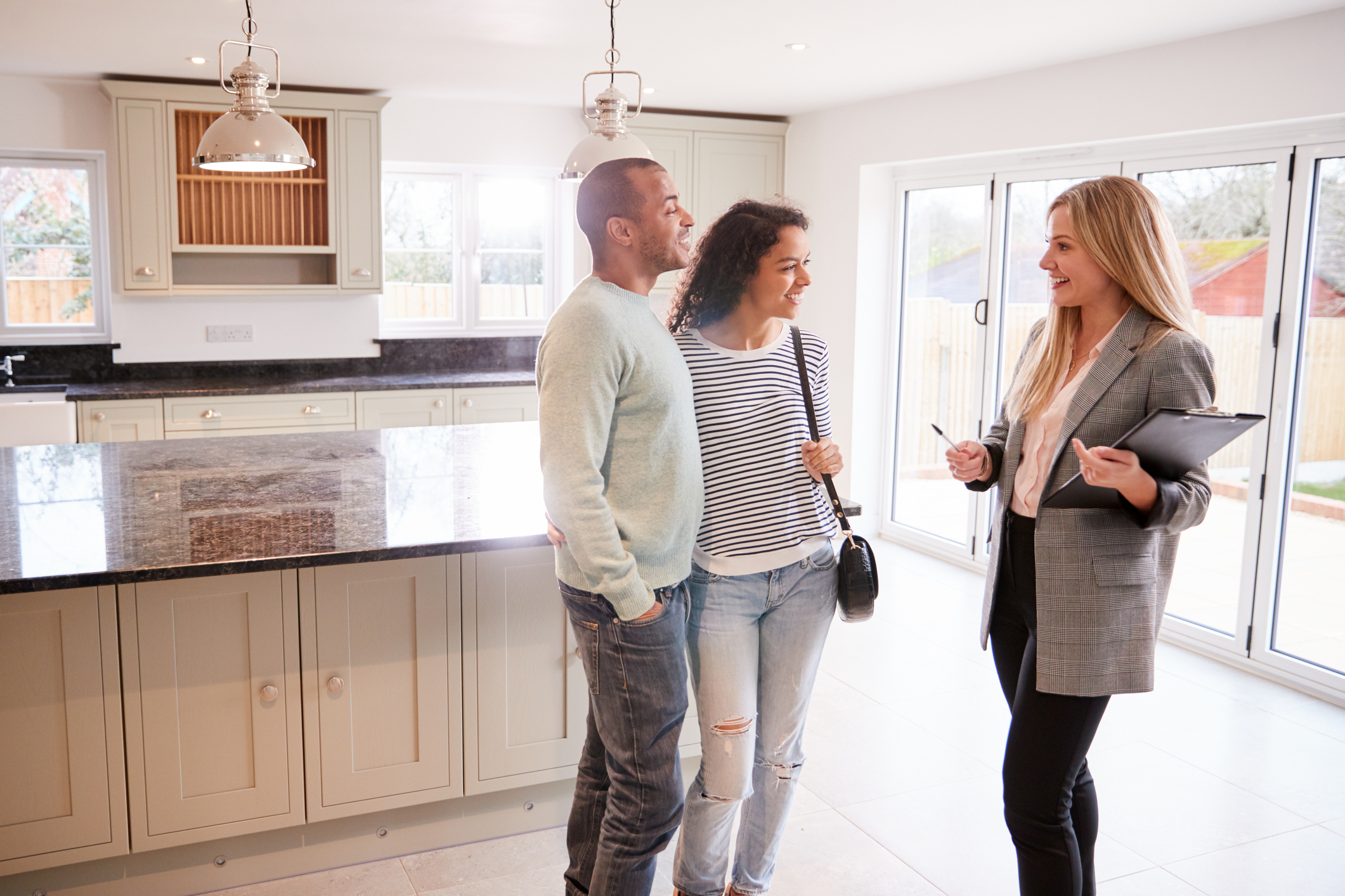 photo-of-realtor-talking-to-couple-while-buying-a-house-in-the-Netherlands