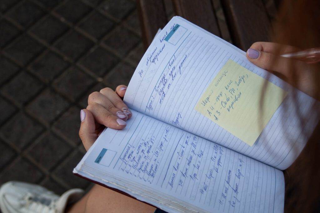 photo-of-person-reading-dutch-agenda-with-writing