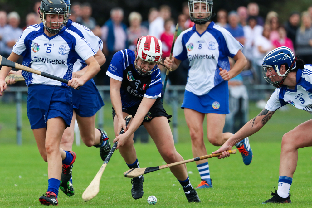 picture-of-women-playing-hurling-on-field-in-cork-ireland-international-sport